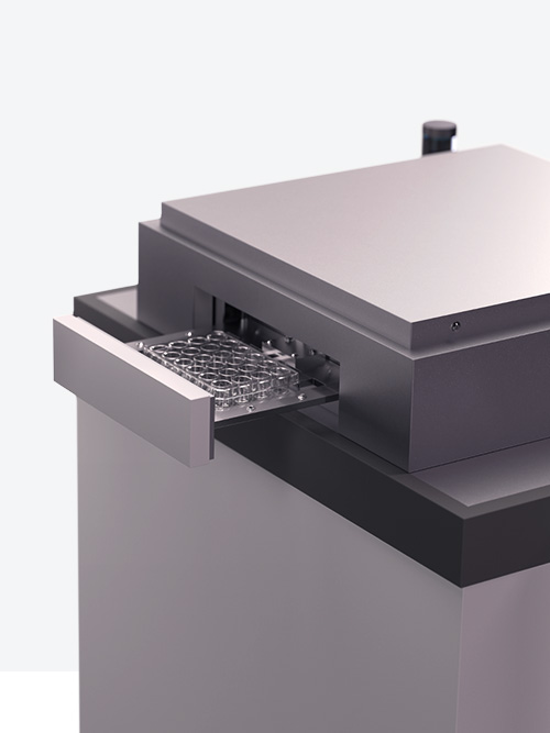 Modern laboratory equipment with open sample drawer.