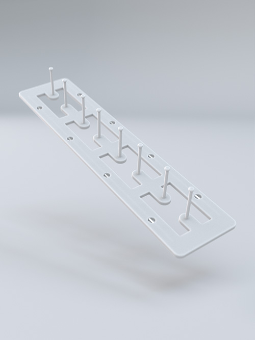 White plastic rack with multiple hooks.